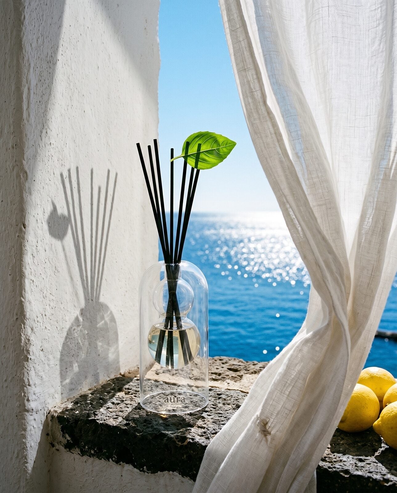 Ponza reed diffuser — pastel harbour editorial scene