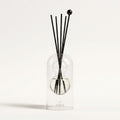 Cassis reed diffuser — clear glass vessel with fiber reeds