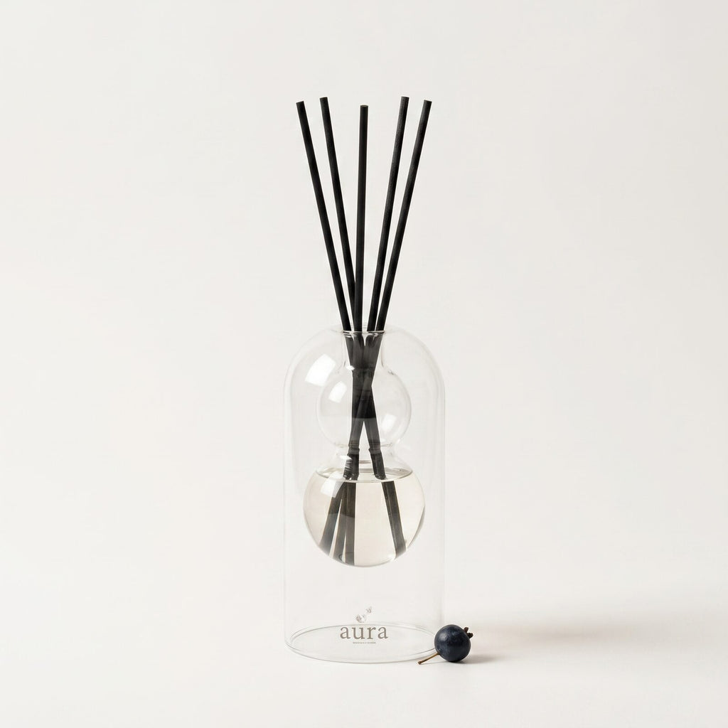 Sardegna reed diffuser — clear glass vessel with fiber reeds