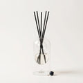 Sardegna reed diffuser — clear glass vessel with fiber reeds