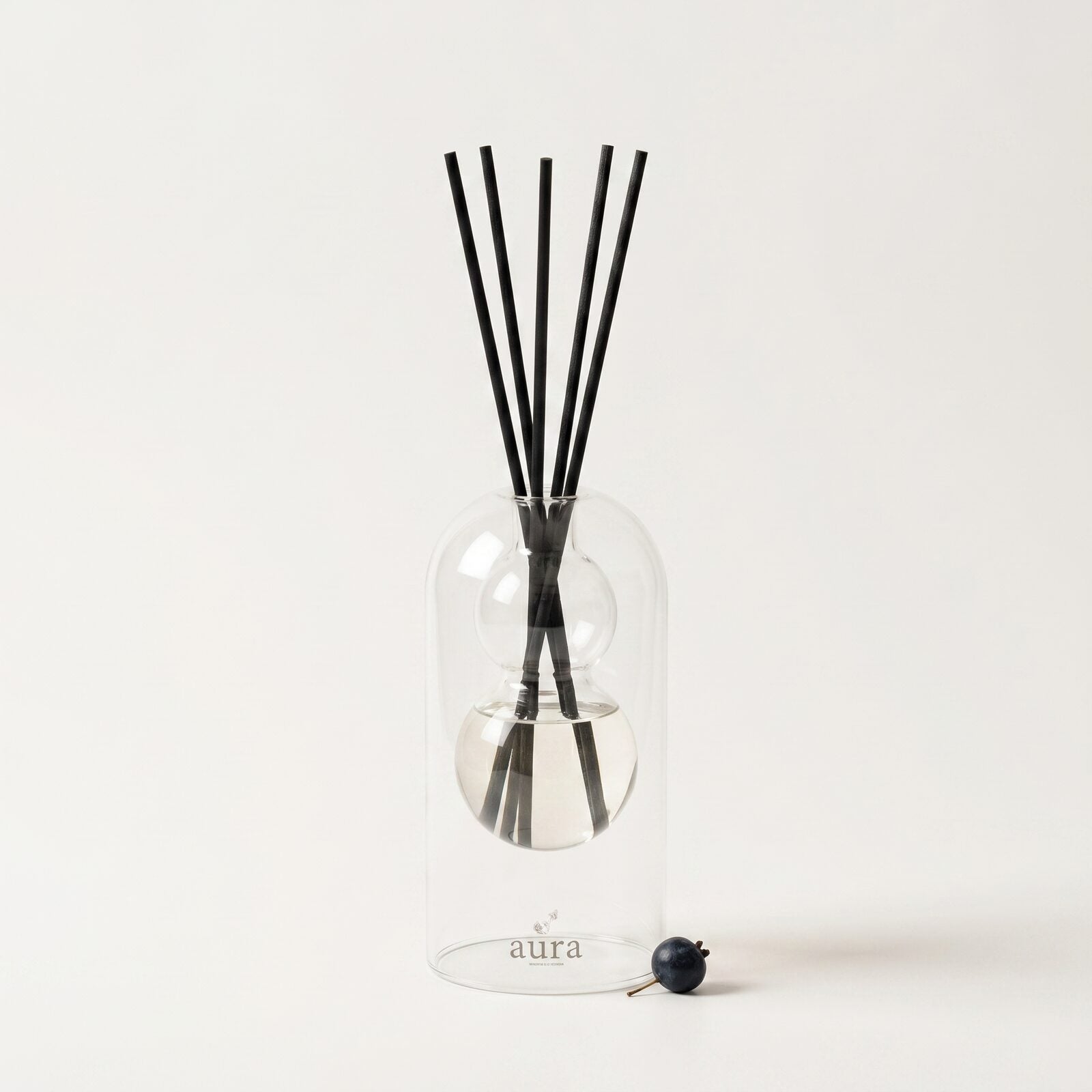 Sardegna reed diffuser — clear glass vessel with fiber reeds