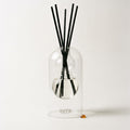 Monaco reed diffuser — clear glass vessel with fiber reeds