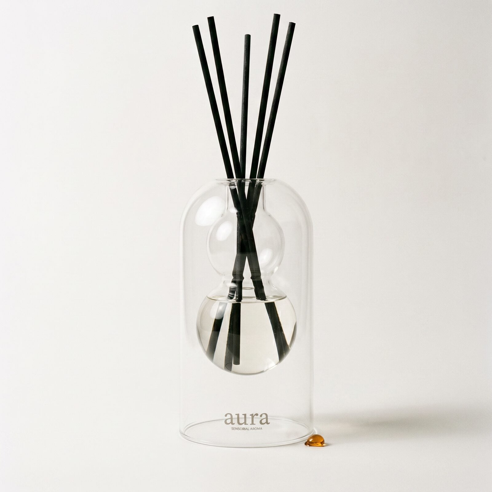 Monaco reed diffuser — clear glass vessel with fiber reeds