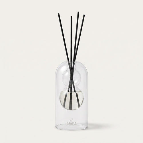 Think Better reed diffuser — clear glass bottle with rattan reeds