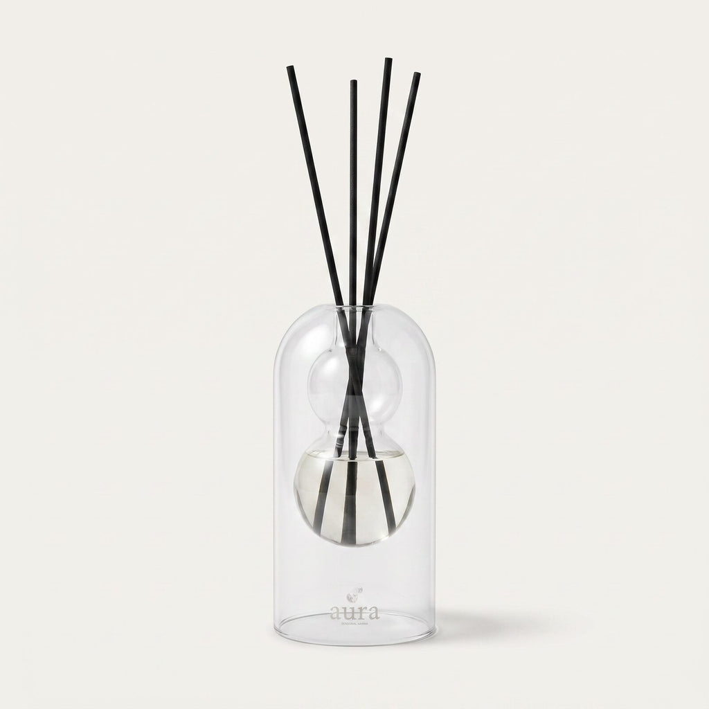 Unwind Better reed diffuser — clear glass bottle with rattan reeds