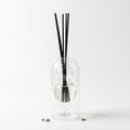 Provence reed diffuser — clear glass vessel with fiber reeds